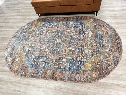 5'3” x 5’10” Oval Rust Fringed Medallion Area Rug